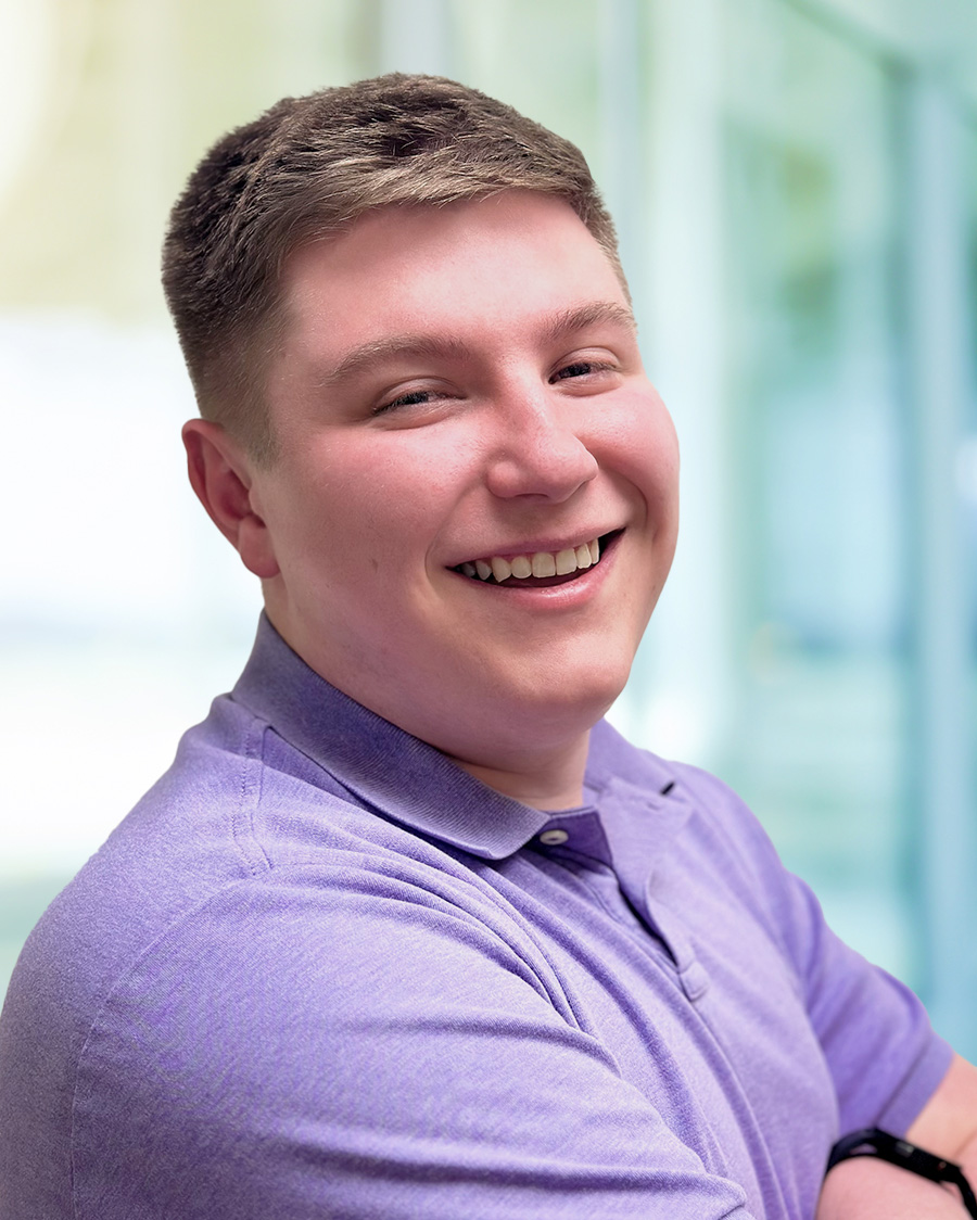man with purple shirt
