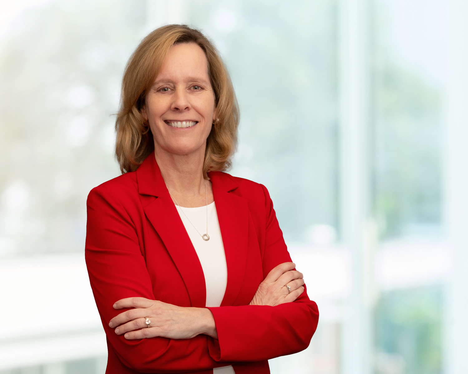 woman in red suit jacket