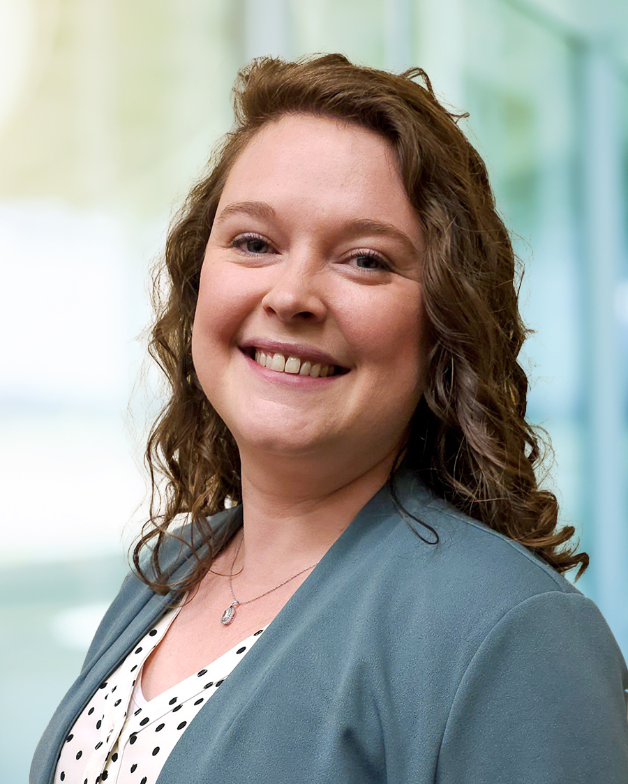 woman with teal jacket