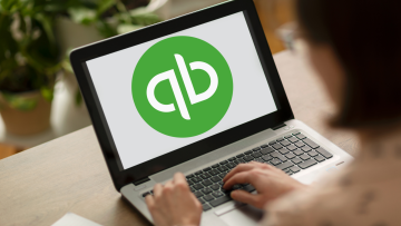laptop screen with quickbooks logo