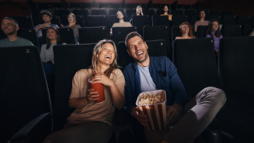 couple watching a movie in a movie theater
