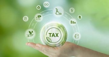 hand holding the word tax