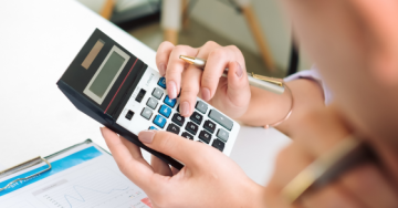 Woman using a calculator