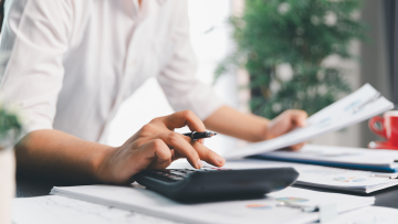 man using calculator