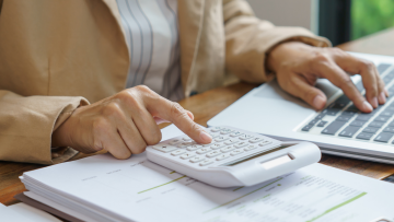 using a calculator and laptop