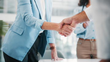 shaking hands during a business deal