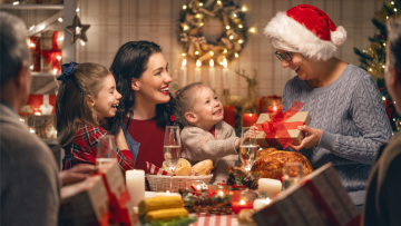 grandmother giving a gift to her grandchildren