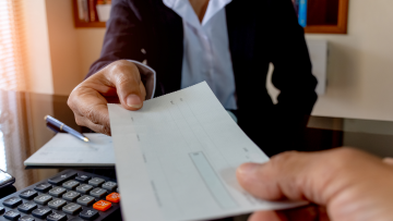 Handing a paycheck