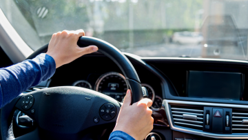 hands on a steering wheel