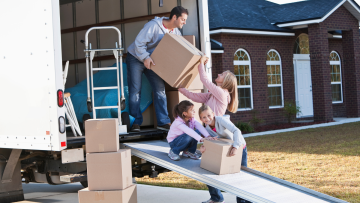 family loading a moving truck