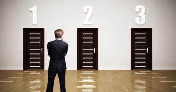 man choosing between three doors