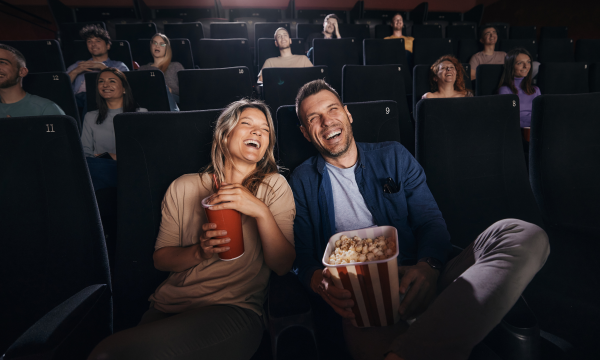 couple watching a movie in a movie theater