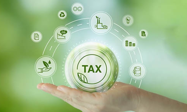 hand holding the word tax