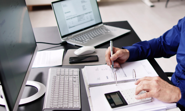 man performing accounting duties