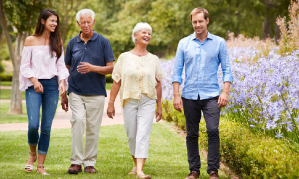 Blended family walking in a garden