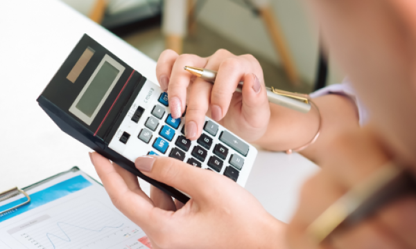 Woman using a calculator