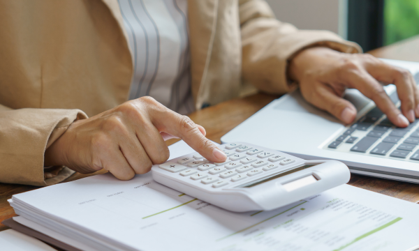 using a calculator and laptop