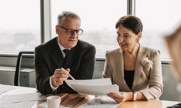 two people reviewing documents