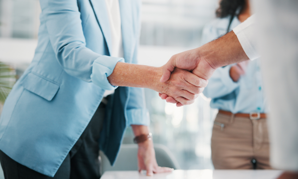 shaking hands during a business deal