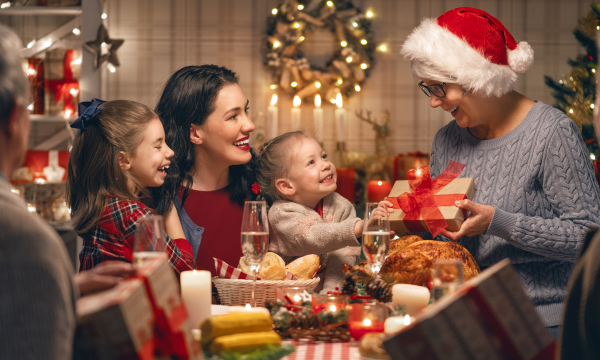 grandmother giving a gift to her grandchildren