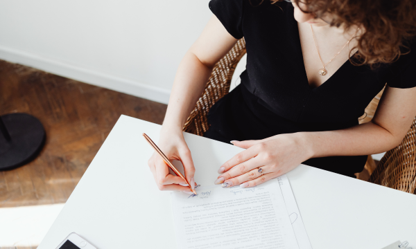 woman signing documents