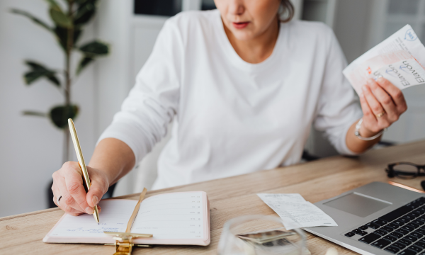woman reconciling receipts