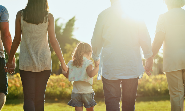 multigenerational family holding hands