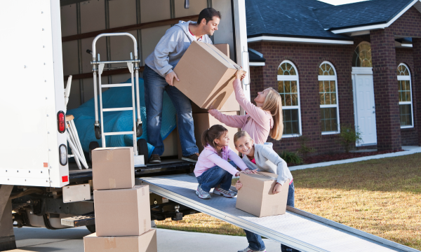 family loading a moving truck