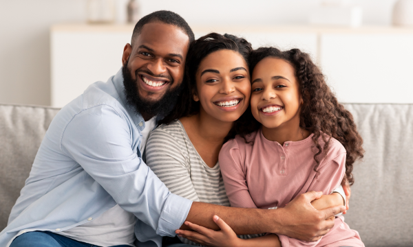 family sitting on a sofa