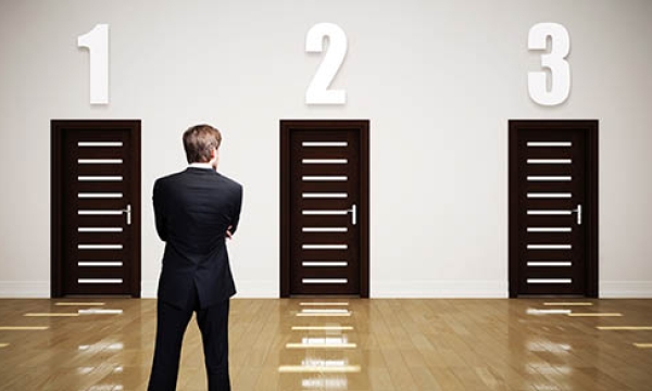 man choosing between three doors