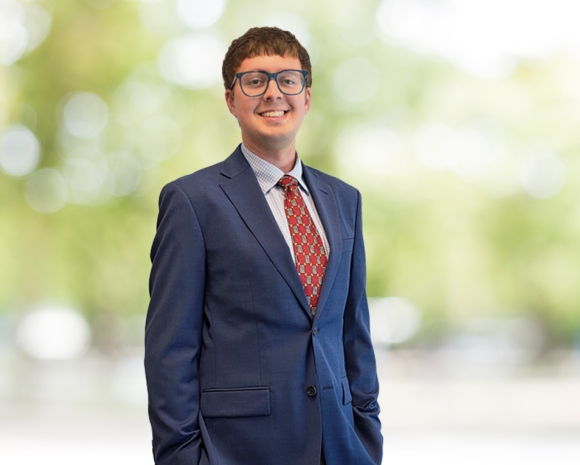man with brown hair and blue suit