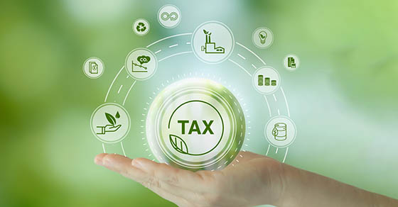 hand holding the word tax