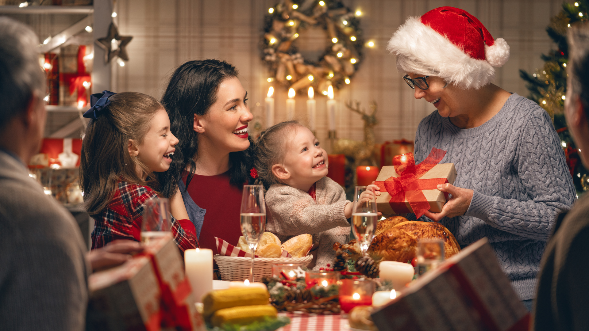 grandmother giving a gift to her grandchildren