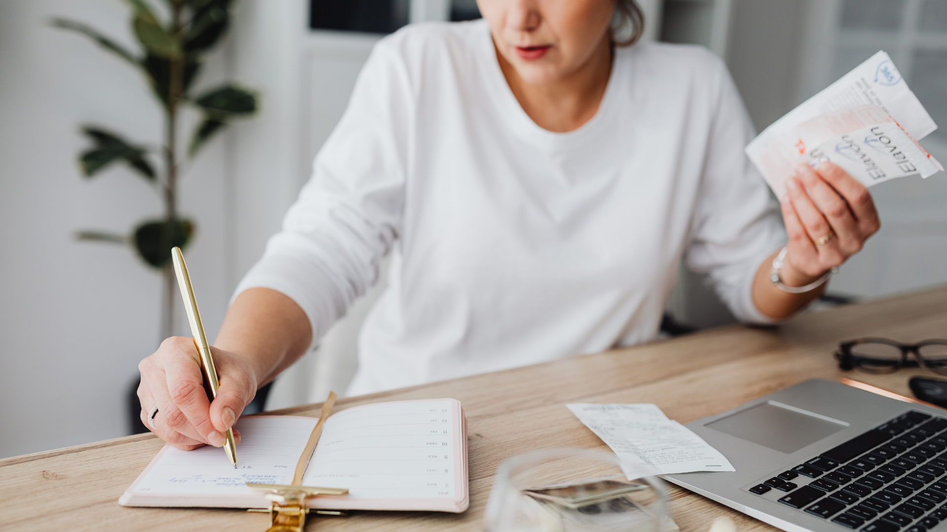 woman reconciling receipts