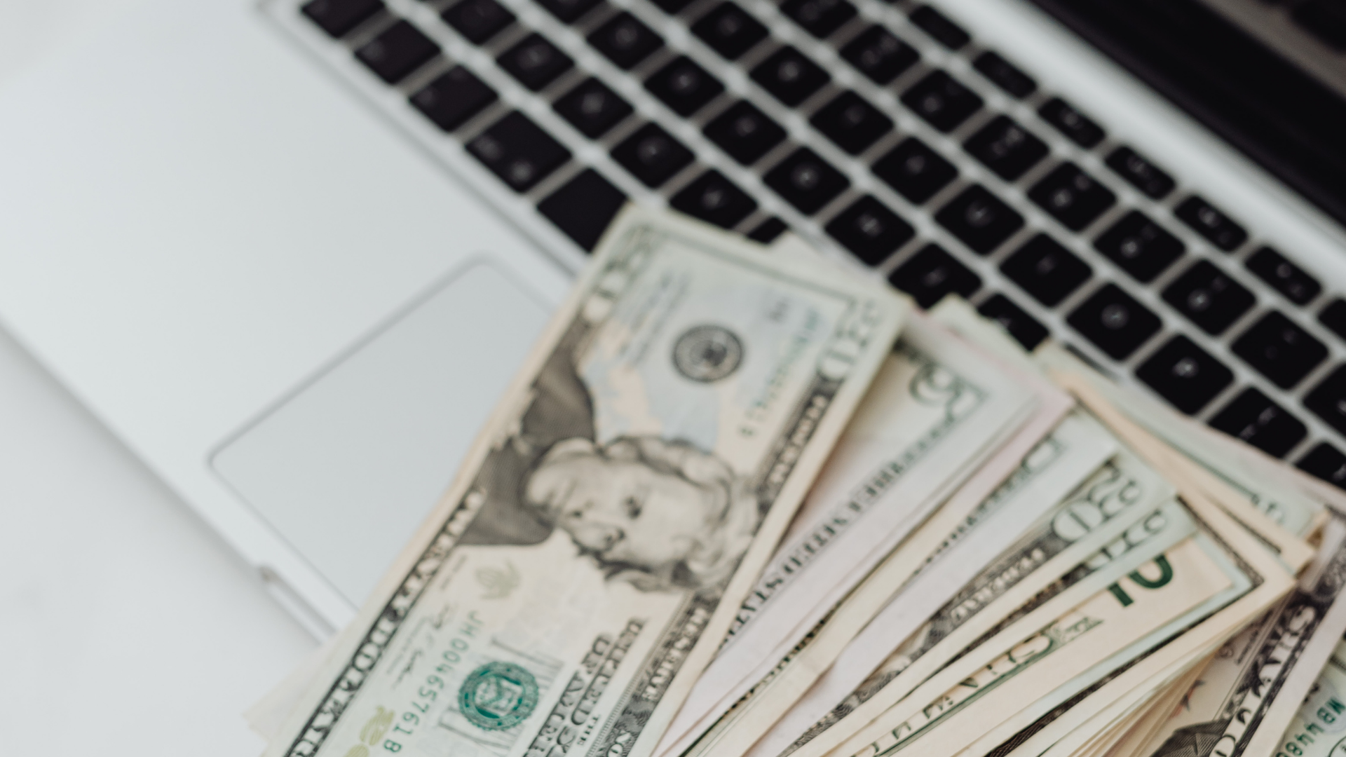 money on laptop