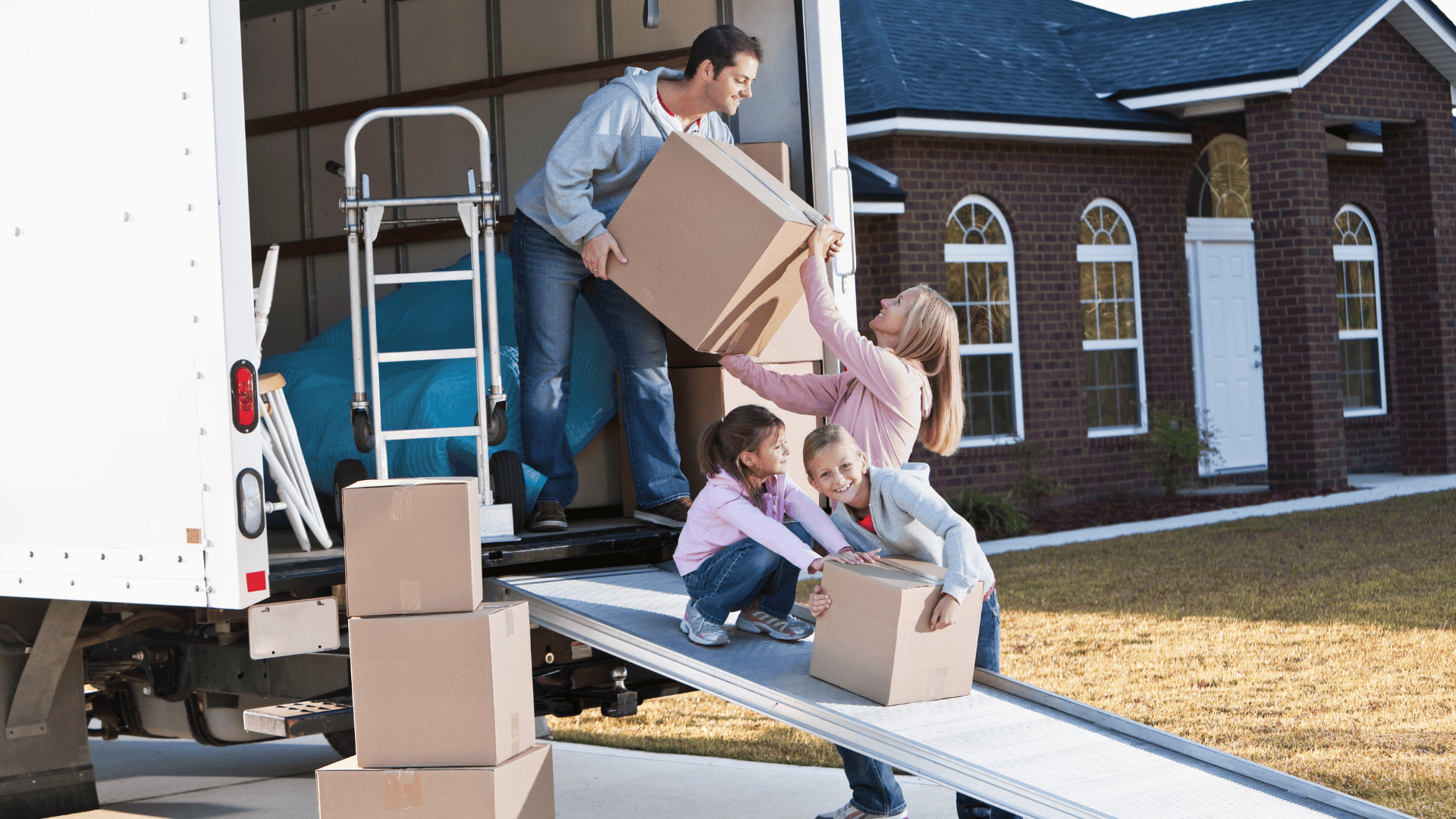 family loading a moving truck