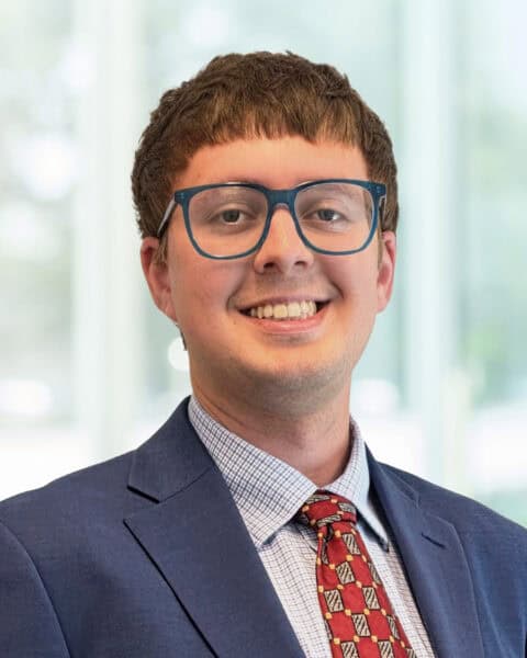 Nick Chapman wearing glasses in professional setting at SEK CPAs.