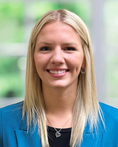 Professional portrait of a smiling woman in business attire at SEK CPAs.