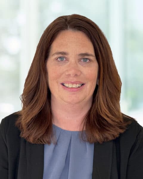 Professional portrait of a woman at SEK CPAs office.