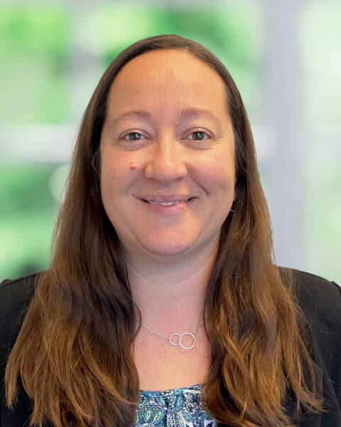 Professional portrait of a woman at SEK CPAs office.