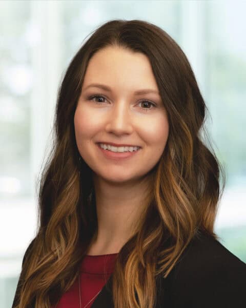 Professional portrait of a young woman in business attire at SEK CPAs.