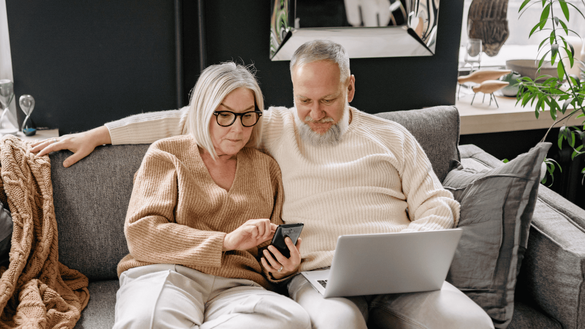 couple reviewing information on devices