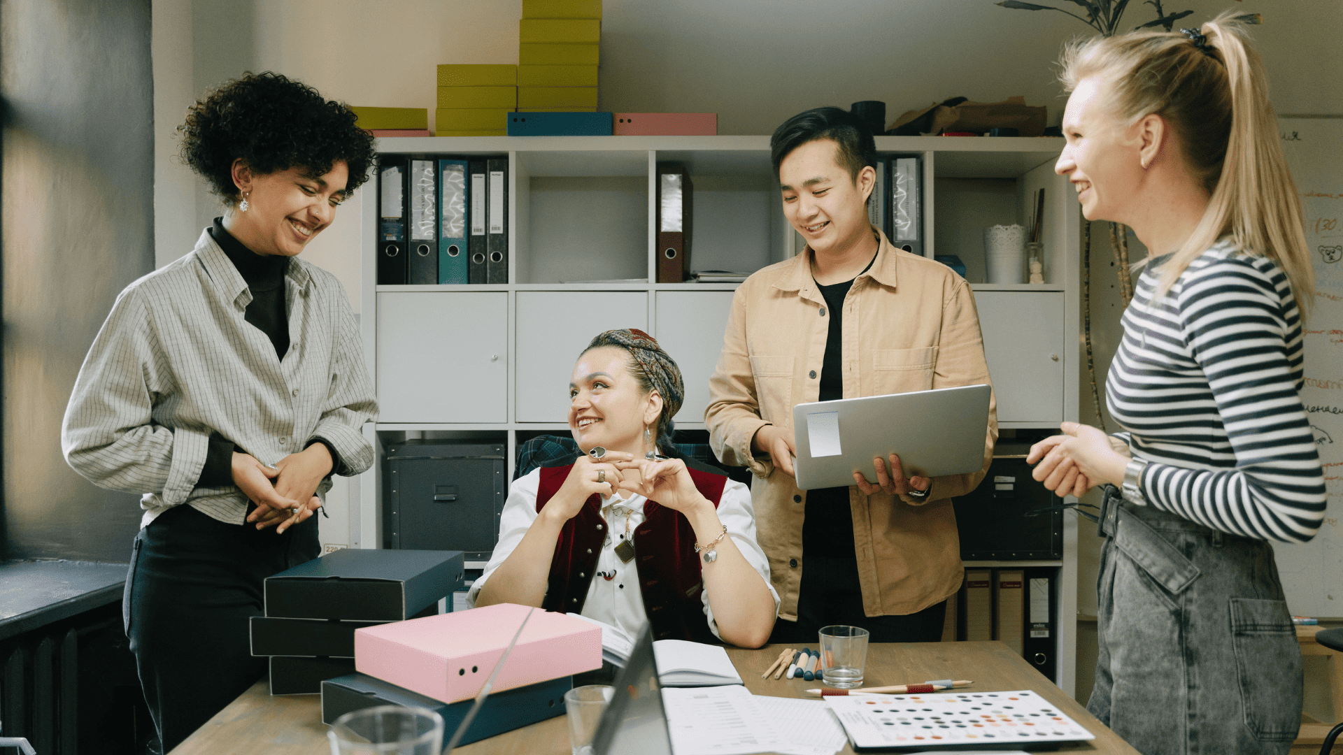 Four individuals meeting in an office