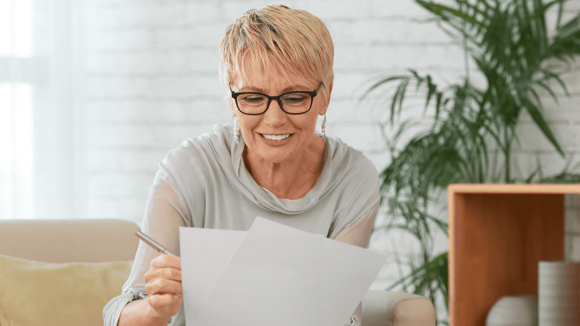 Middle-aged woman reviewing paperwork