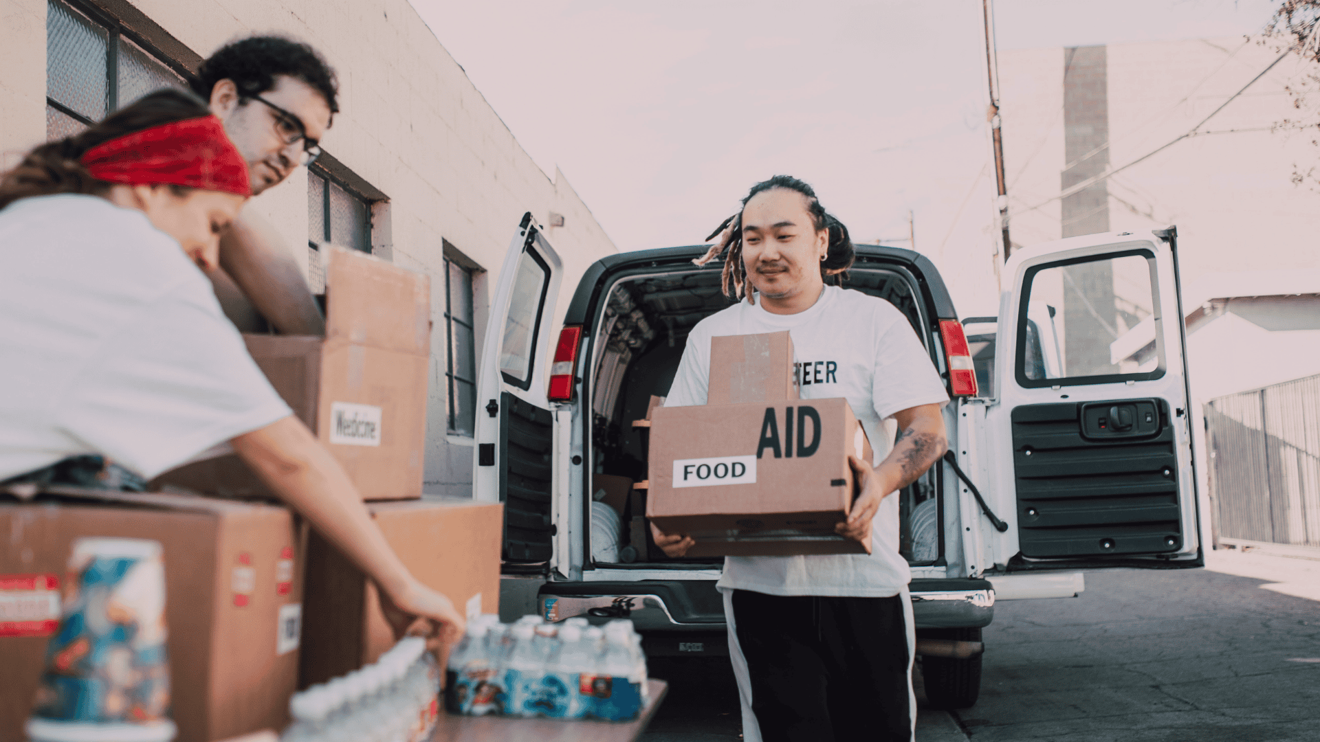 volunteers unloading boxes