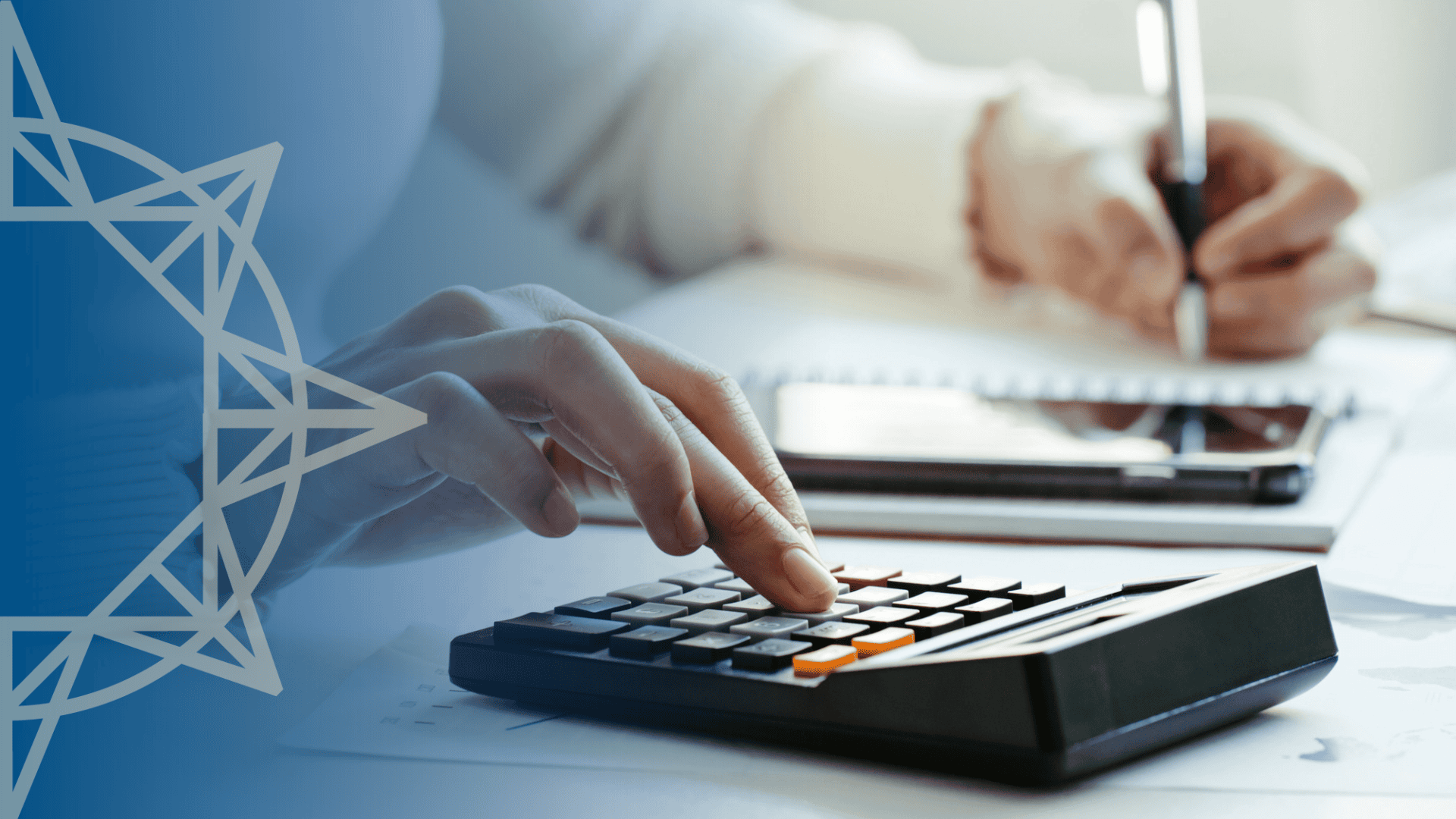 a woman using a calculator while writing